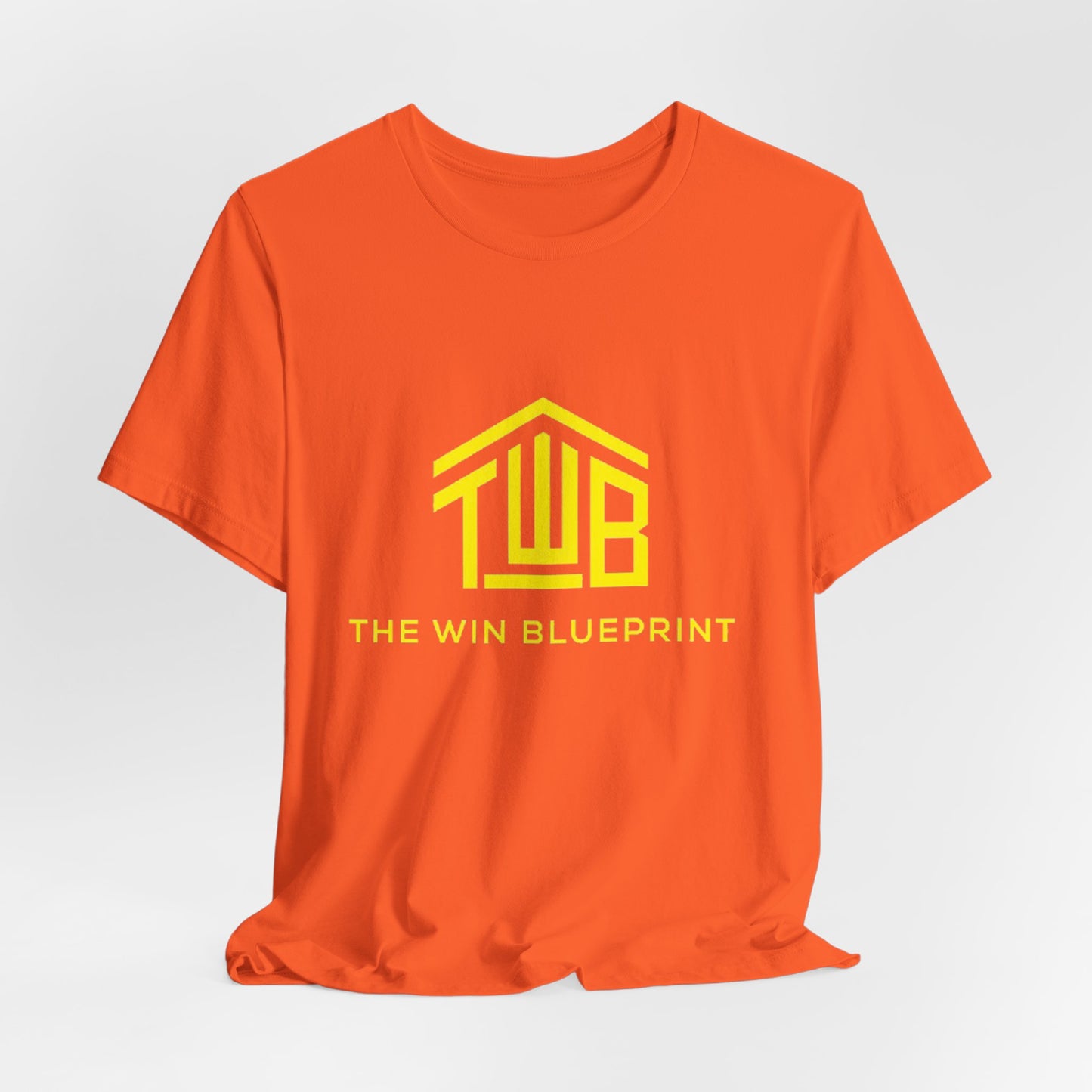 The official The Win Blueprint Tee — Yellow Logo Graphic T-Shirt