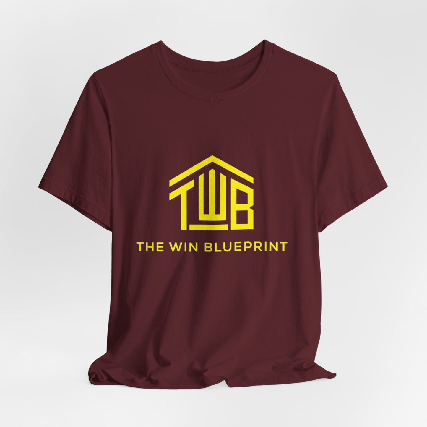 The official The Win Blueprint Tee — Yellow Logo Graphic T-Shirt